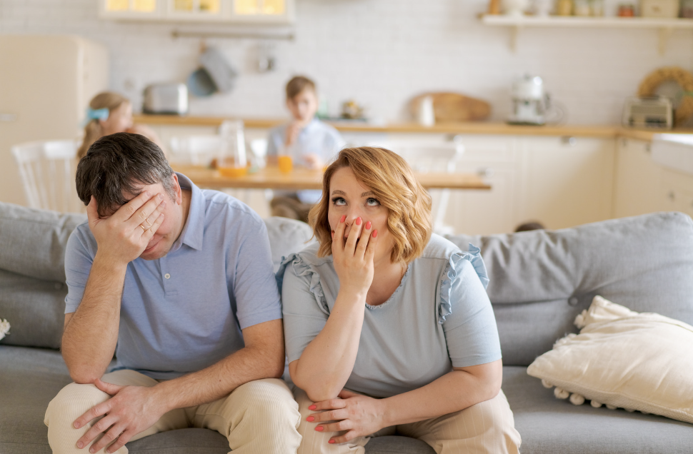 frustrated parents at kitchen table